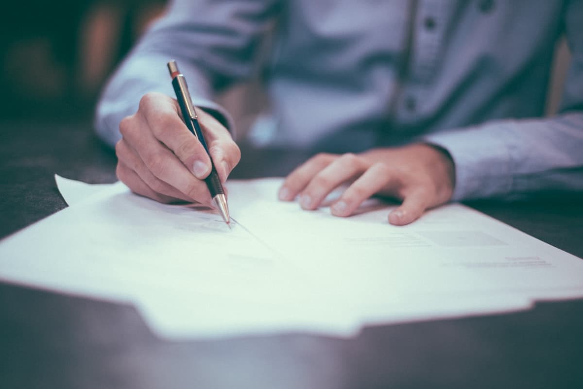 Translator reviewing an official document line by line before certification