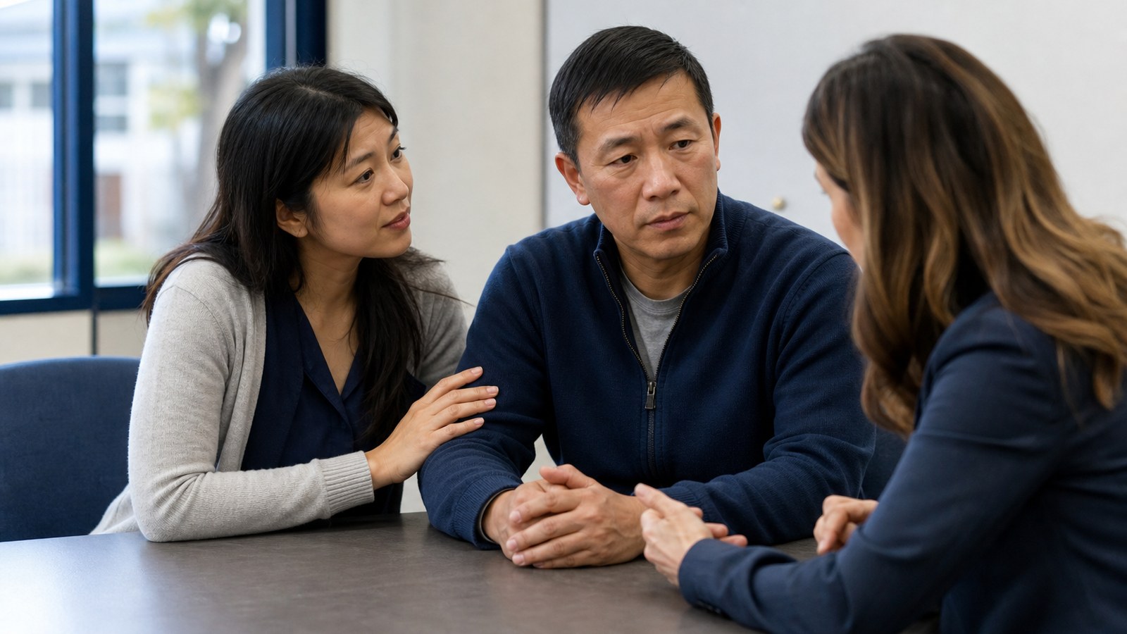 Interpreter supporting a parent during a Bay Area school district IEP meeting