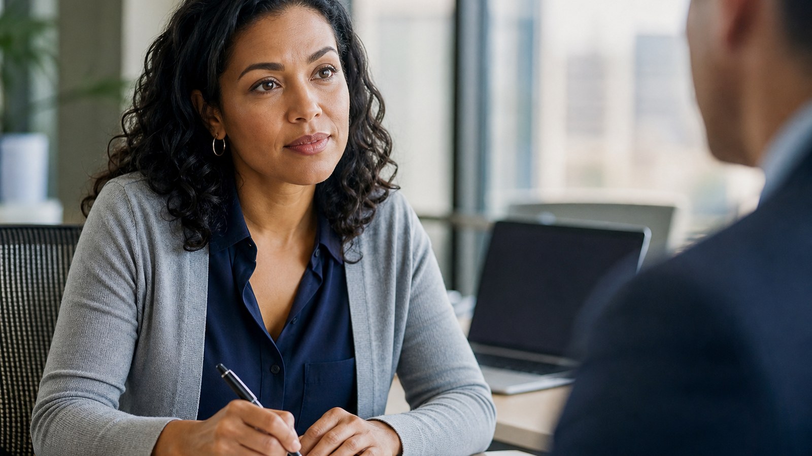 Professional interpreter maintaining confidentiality during a Bay Area business meeting